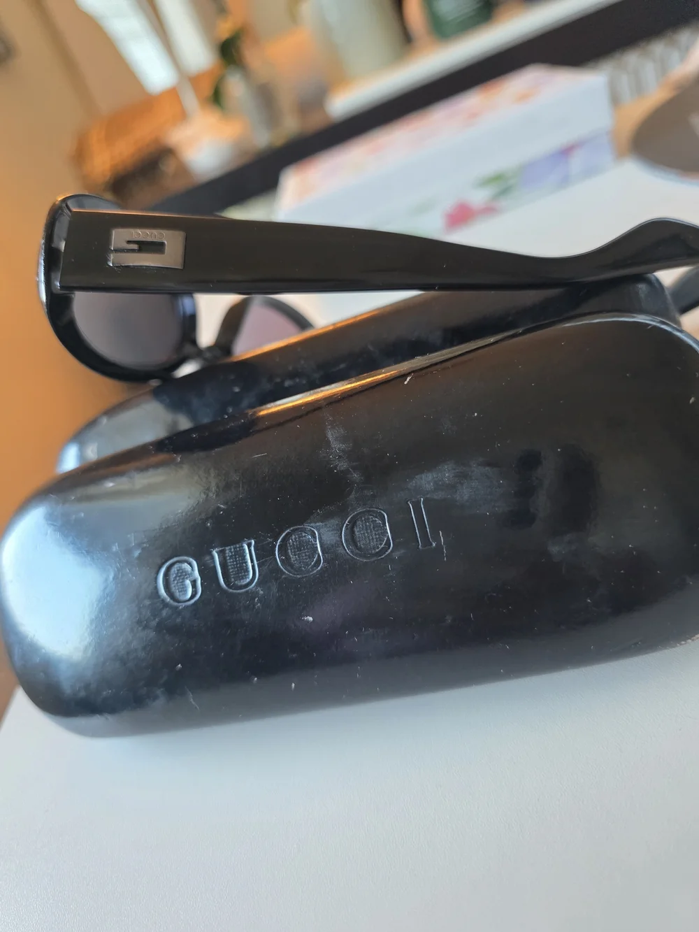 Gucci Black Oval Sunglasses with Temple Logo Plaque 2419/N